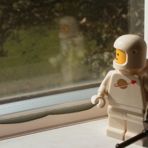 nu_montag’s profile: a Lego astronaut gazes at its reflection in a window overlooking a tree