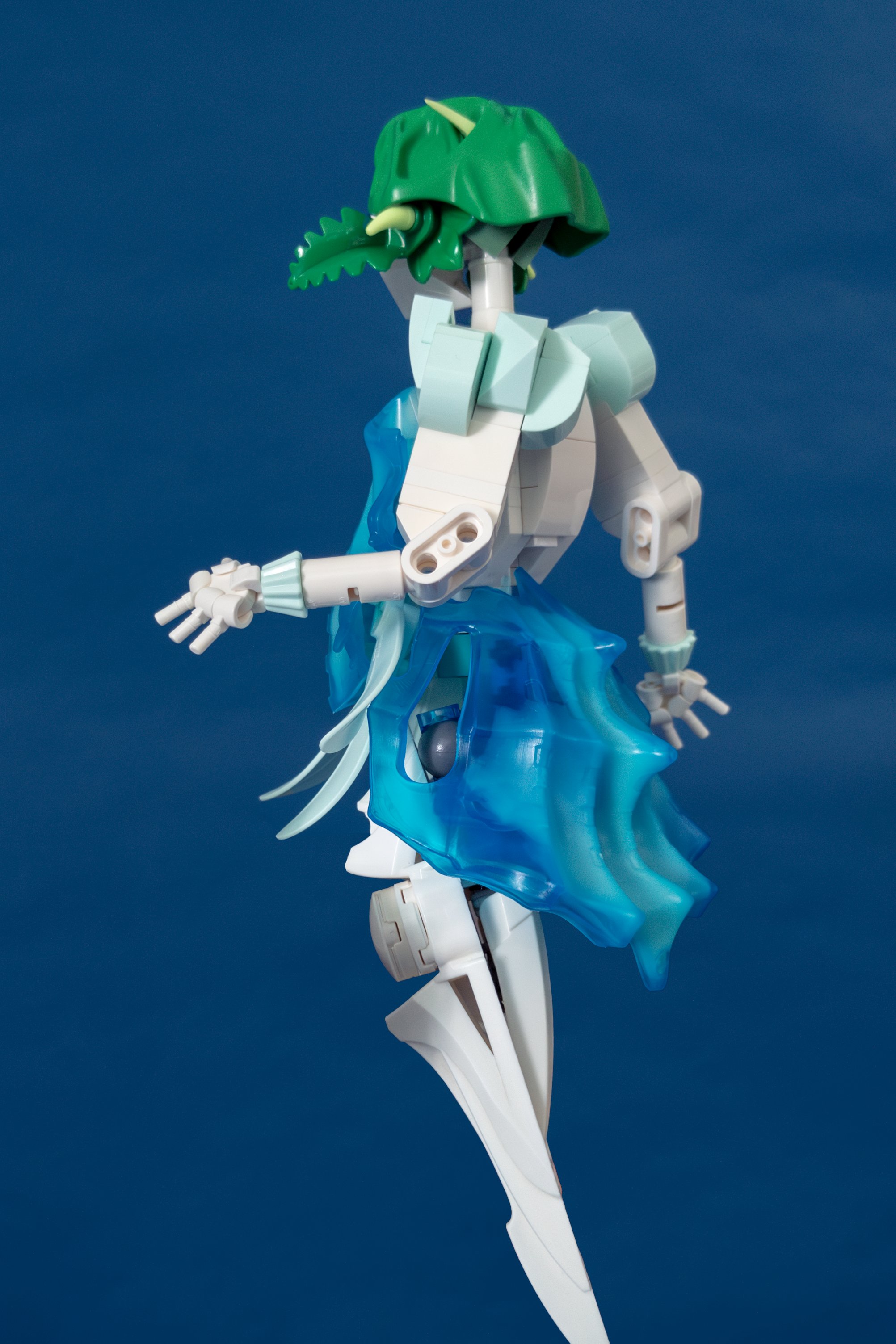 Figure faces away from camera, arm raised, mid-stride